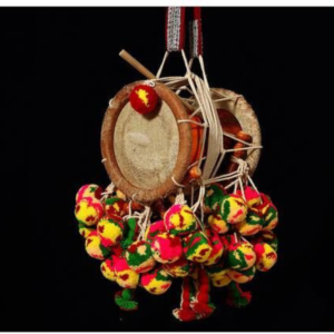 Musicians performing Kathakali music with traditional instruments, setting the rhythm for the dance.